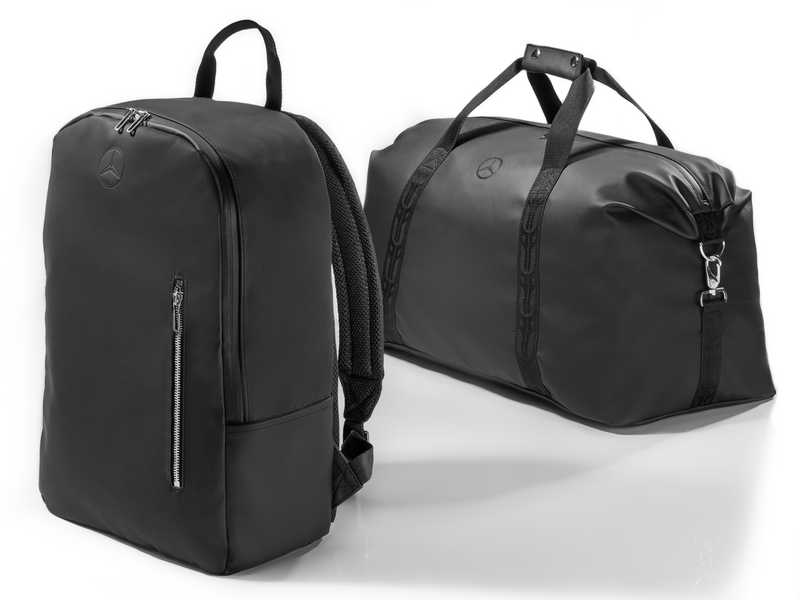 Rucksack. Black. Polyurethane/polyester. Water-repellent. Main compartment with 2-way zipper and various inner compartments. Zipped compartment on front. Padded back section. Trolley attaching function. Adjustable, padded shoulder belt. Carrying handle. Dimensions approx. 30 x 13 x 43 cm.