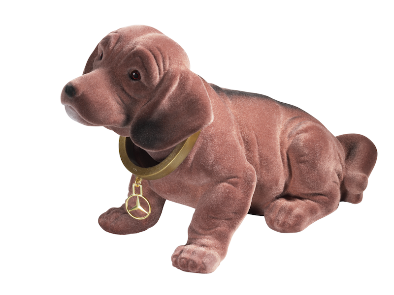 Nodding dog. Brown. Plastic with synthetic fur. Golden collar with brass Mercedes star. Made in Germany. Dimensions approx. 29 x 18 cm.