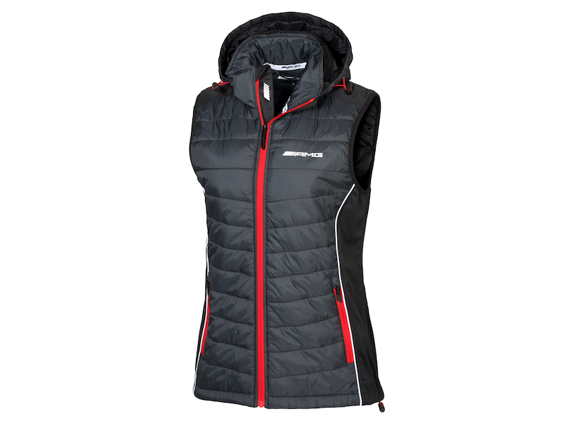 AMG ladies' gilet. Selenite grey/red/white. Outer fabric softshell 100 % polyester, body 100 % nylon with polyurethane coating, taffeta lining and lightweight wadding 100 % polyester. Windproof. Warm. Detachable hood. Water-resistant zip. High-closing collar with chin guard. Various pockets. Slim fit. Sizes XS-XL.